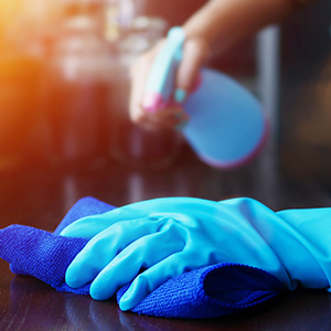 closeup of blue rubber glove holding microfiber cleaning cloth bensalem pa